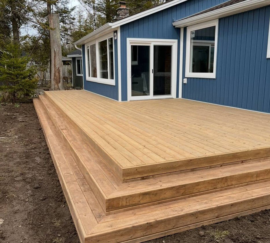 New wood deck on blue house