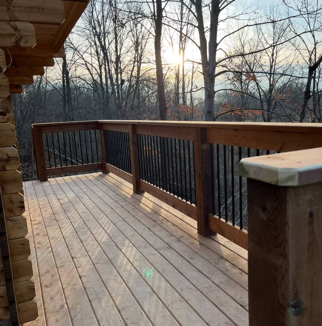 Cedar deck railing at sunset